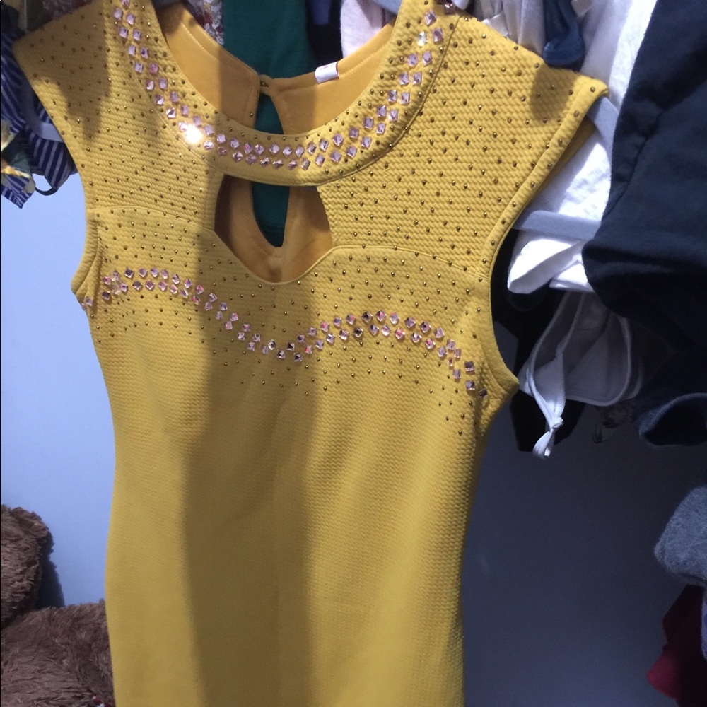 A yellow dress tight fitted with gems